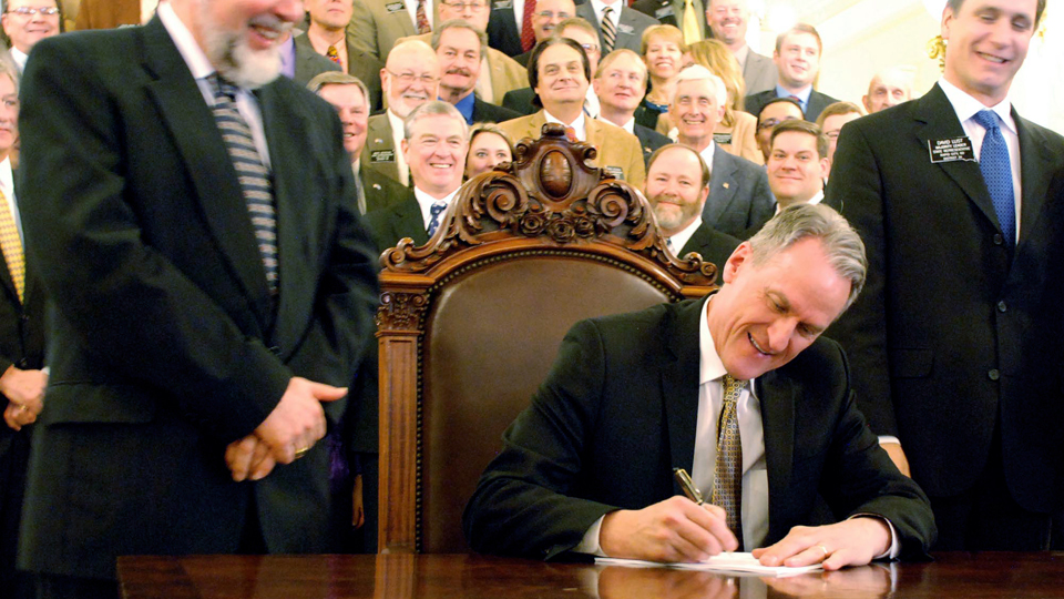 South Dakota governor Dennis Daugaard signing armed teacher bill